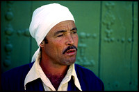 man in front of green door, algeria, 1980